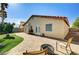 A lovely backyard featuring a stone patio, green lawn, and landscaping at 931 Highland Trails Ave, Henderson, NV 89015
