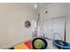 Bedroom/playroom featuring neutral walls, light floors and play set hanging from ceiling at 931 Highland Trails Ave, Henderson, NV 89015