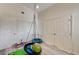 Bedroom featuring a sensory swing and gray wood-style floors at 931 Highland Trails Ave, Henderson, NV 89015