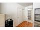 Bedroom featuring wood floors, a closet, and a door leading to another room at 931 Highland Trails Ave, Henderson, NV 89015