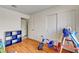 Bedroom with hardwood floors, closets, and toys at 931 Highland Trails Ave, Henderson, NV 89015