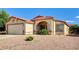 Well-maintained single-story home featuring a tiled roof and a desert-landscaped front yard at 931 Highland Trails Ave, Henderson, NV 89015