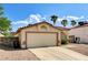 Charming single-story home with a two-car garage and low-maintenance desert landscaping at 931 Highland Trails Ave, Henderson, NV 89015