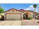 Inviting single-story home featuring a well-manicured yard, tiled roof, and attached two-car garage at 931 Highland Trails Ave, Henderson, NV 89015