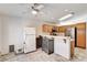 Bright kitchen area featuring tile floors, stainless steel appliances, and good natural lighting at 931 Highland Trails Ave, Henderson, NV 89015