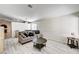 Bright living room featuring new flooring and a cozy seating area at 931 Highland Trails Ave, Henderson, NV 89015