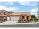 Charming single-story home featuring a well-manicured front yard and tile roof at 9329 Mountain Cliffs Ave, Las Vegas, NV 89129