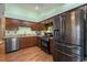 Modern kitchen with stainless steel appliances, granite countertops, and wooden cabinets at 9329 Mountain Cliffs Ave, Las Vegas, NV 89129