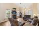 Comfortable living room featuring a fireplace, vaulted ceilings, and wood-look flooring at 9329 Mountain Cliffs Ave, Las Vegas, NV 89129