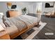 Bright bedroom featuring hardwood floors, neutral walls, minimalist decor and ensuite bathroom at 9384 Hosner St, Las Vegas, NV 89178