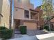 Modern two-story home featuring a brick facade, covered balcony, and a two-car garage at 9384 Hosner St, Las Vegas, NV 89178
