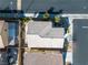 Overhead view of a home, showcasing its roof, landscaping, backyard patio, and proximity to neighboring houses at 9713 Kampsville Ave, Las Vegas, NV 89148