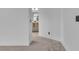 Hallway leads to a bathroom with light wood vanity and ample natural light at 9713 Kampsville Ave, Las Vegas, NV 89148