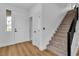 Hallway with stairway and natural light entering through glass door at 9713 Kampsville Ave, Las Vegas, NV 89148