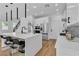Open-concept kitchen featuring stainless steel appliances, a large island and breakfast bar at 9713 Kampsville Ave, Las Vegas, NV 89148