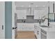 Sleek kitchen featuring stainless steel appliances, white cabinets, and modern design elements at 9713 Kampsville Ave, Las Vegas, NV 89148