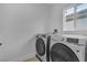 Close-up of modern, energy-efficient Samsung washer and dryer in the laundry room, offering convenience at 9713 Kampsville Ave, Las Vegas, NV 89148