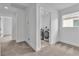 Well-lit laundry room with modern washer and dryer units, making laundry chores easier at 9713 Kampsville Ave, Las Vegas, NV 89148