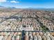 Aerial view of 9713 Kampsville neighborhood featuring rows of homes and mountains in the distance at 9713 Kampsville Ave, Las Vegas, NV 89148