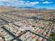 Wide aerial shot showcases a residential area, close proximity to the mountains. Address of home is 9713 Kampsville at 9713 Kampsville Ave, Las Vegas, NV 89148