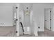 Bright landing with modern light fixture and neutral carpet, leading to other rooms at 9713 Kampsville Ave, Las Vegas, NV 89148