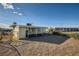 Spacious backyard with potential, featuring a fence and covered patio, perfect for outdoor living at 103 W Victory Rd, Henderson, NV 89015