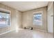 Bedroom with laminate flooring and natural light from two windows at 103 W Victory Rd, Henderson, NV 89015