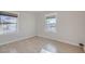 Bedroom featuring hard surface floors and two windows providing natural light at 103 W Victory Rd, Henderson, NV 89015