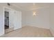 Bedroom with hard surface floors, neutral walls, and access to the utility room at 103 W Victory Rd, Henderson, NV 89015