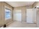 Cozy bedroom features light wood paneling, ample natural light, and a spacious closet for optimal storage at 103 W Victory Rd, Henderson, NV 89015