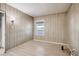 Bright bedroom showcasing light wood paneling and a window offering natural light at 103 W Victory Rd, Henderson, NV 89015