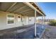 Covered patio area showcasing a paved surface and backyard access, ideal for outdoor relaxation at 103 W Victory Rd, Henderson, NV 89015