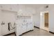 Utility room showcasing vintage white cabinets and an adjoining doorway at 103 W Victory Rd, Henderson, NV 89015