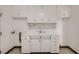 Utility room featuring vintage white cabinets offering plenty of storage space at 103 W Victory Rd, Henderson, NV 89015
