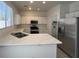 Modern kitchen with white cabinets, stainless steel appliances, and ample counter space at 1030 Country Skies Ave, Las Vegas, NV 89123