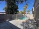 Fully fenced backyard pool provides privacy and security for enjoyable outdoor recreation at 1030 Country Skies Ave, Las Vegas, NV 89123