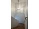 Carpeted staircase with modern light fixture at 1030 Country Skies Ave, Las Vegas, NV 89123