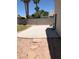 Spacious backyard featuring a concrete patio and a small lawn area at 10342 Spider Rock Ave, Las Vegas, NV 89135