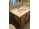 Bathroom vanity with modern fixtures, mirror, and light wood cabinets at 10342 Spider Rock Ave, Las Vegas, NV 89135