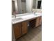 Bathroom vanity with double sinks and granite countertop at 10342 Spider Rock Ave, Las Vegas, NV 89135