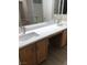 Bright bathroom featuring double sink vanity, mirrors, and tub at 10342 Spider Rock Ave, Las Vegas, NV 89135