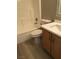Bright bathroom with white tub, toilet and updated vanity at 10342 Spider Rock Ave, Las Vegas, NV 89135