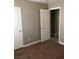 Cozy bedroom featuring neutral color walls and a closet at 10342 Spider Rock Ave, Las Vegas, NV 89135