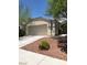 Charming single-story home with desert landscaping and a two-car garage on a sunny day at 10342 Spider Rock Ave, Las Vegas, NV 89135