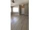 Bright living room featuring vaulted ceiling, modern ceiling fan and durable floors at 10342 Spider Rock Ave, Las Vegas, NV 89135