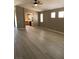 Open living space with wood-look flooring, seamlessly connects to the kitchen at 10342 Spider Rock Ave, Las Vegas, NV 89135