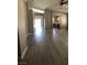 Bright living room with views to the kitchen and sliding patio doors at 10342 Spider Rock Ave, Las Vegas, NV 89135