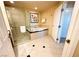 Luxurious bathroom with glass shower, soaking tub, and bright neutral tile at 125 E Harmon Ave # 2718, Las Vegas, NV 89109