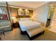 Comfortable bedroom featuring a king-size bed, stylish decor, and a glimpse of a modern bathroom at 125 E Harmon Ave # 2718, Las Vegas, NV 89109
