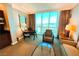 Bright living room boasts city views, dining table, seating area, and kitchenette for convenient living at 125 E Harmon Ave # 2718, Las Vegas, NV 89109